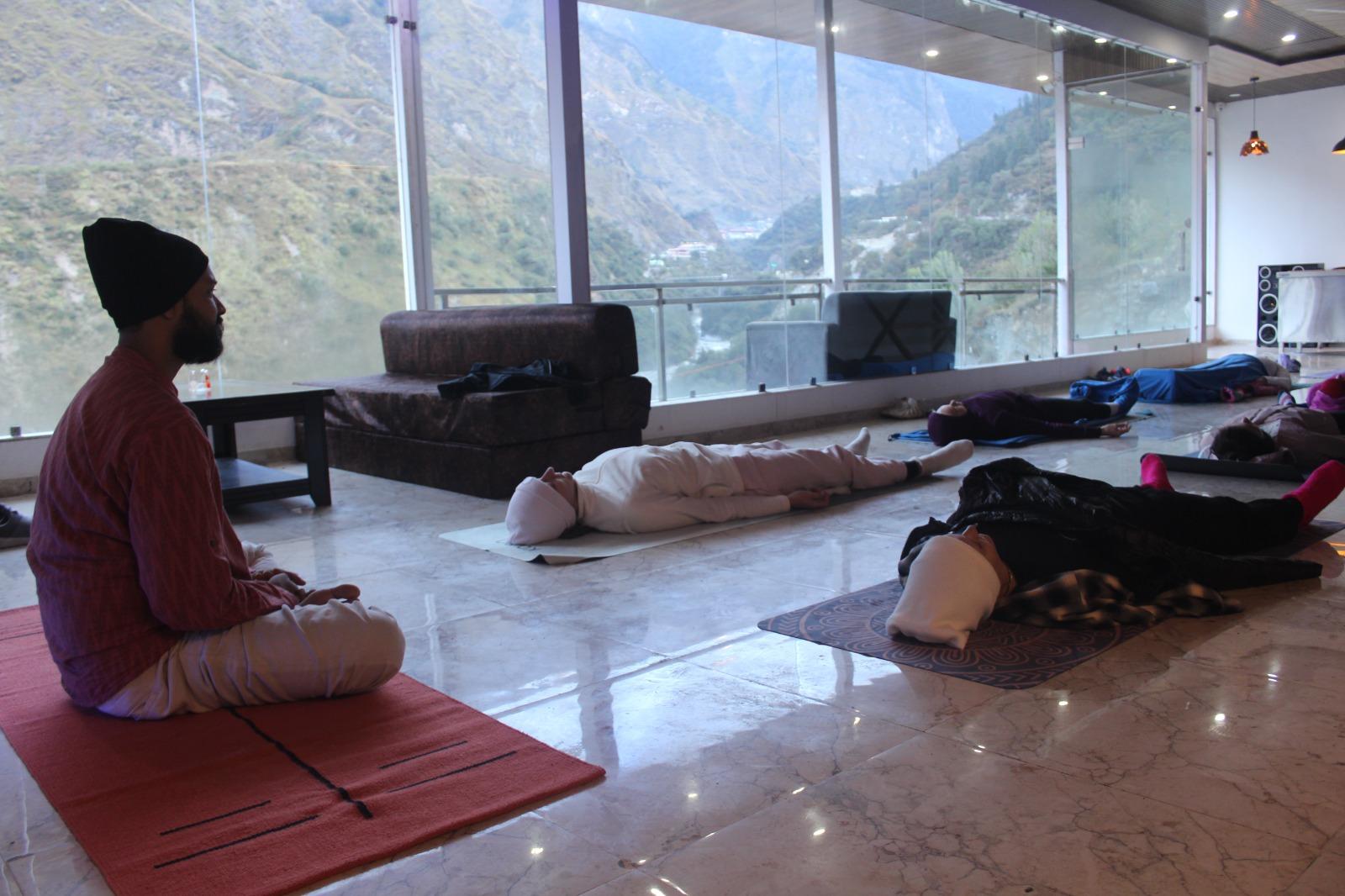 Rustic yoga shala nestled among trees
